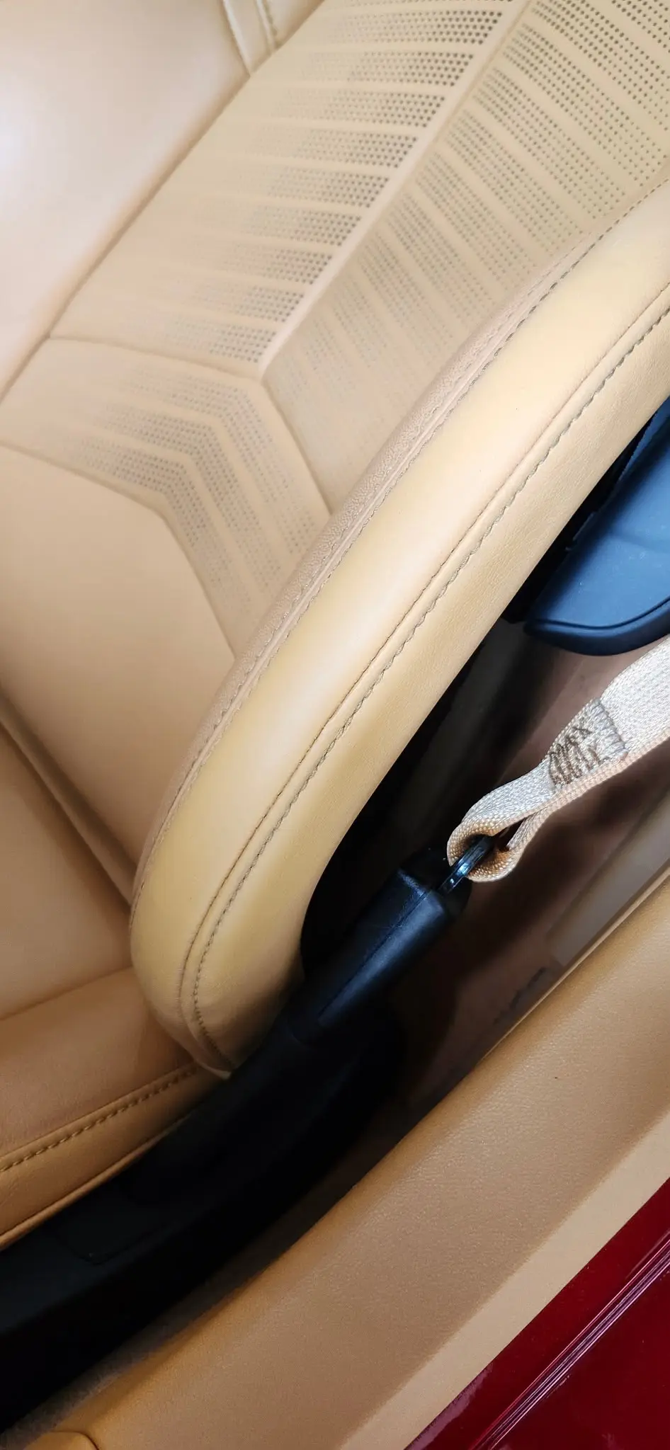 A richly recoloured brown leather cushion, smooth and conditioned